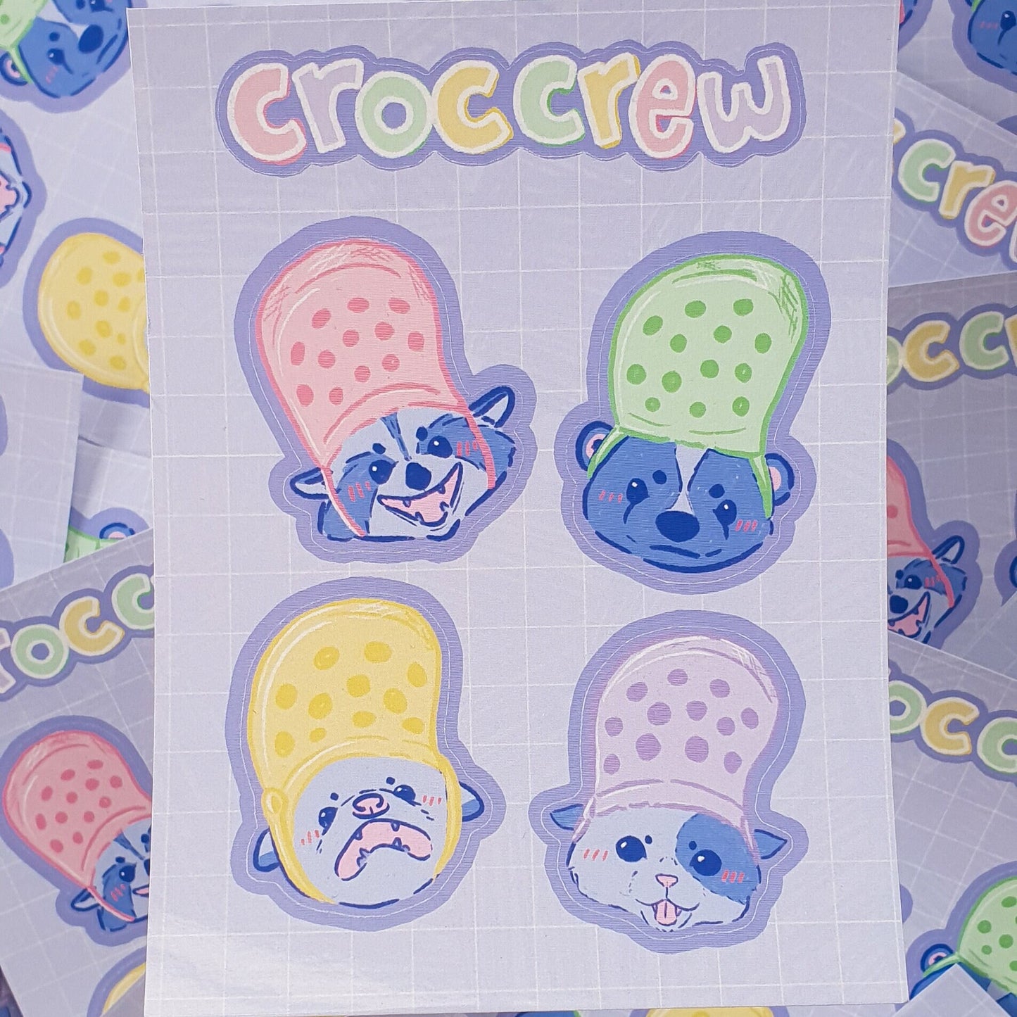 Croc Crew Sticker Sheet Featuring An Opossum, Skunk, Raccoon and Cat Wearing Crocs As Hats - Koodle