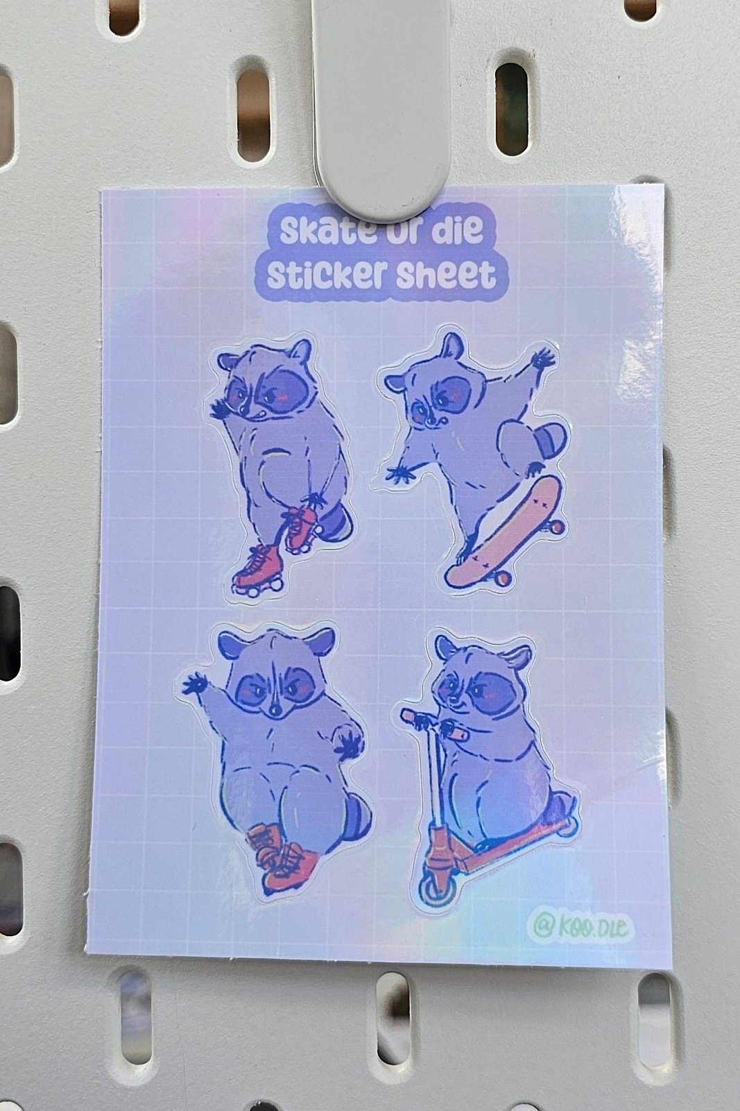 Skate Or Die Holographic Skateboarding, Rollerskating, Rollerblading, and Scooter riding Raccoon Sticker Sheet - Koodle