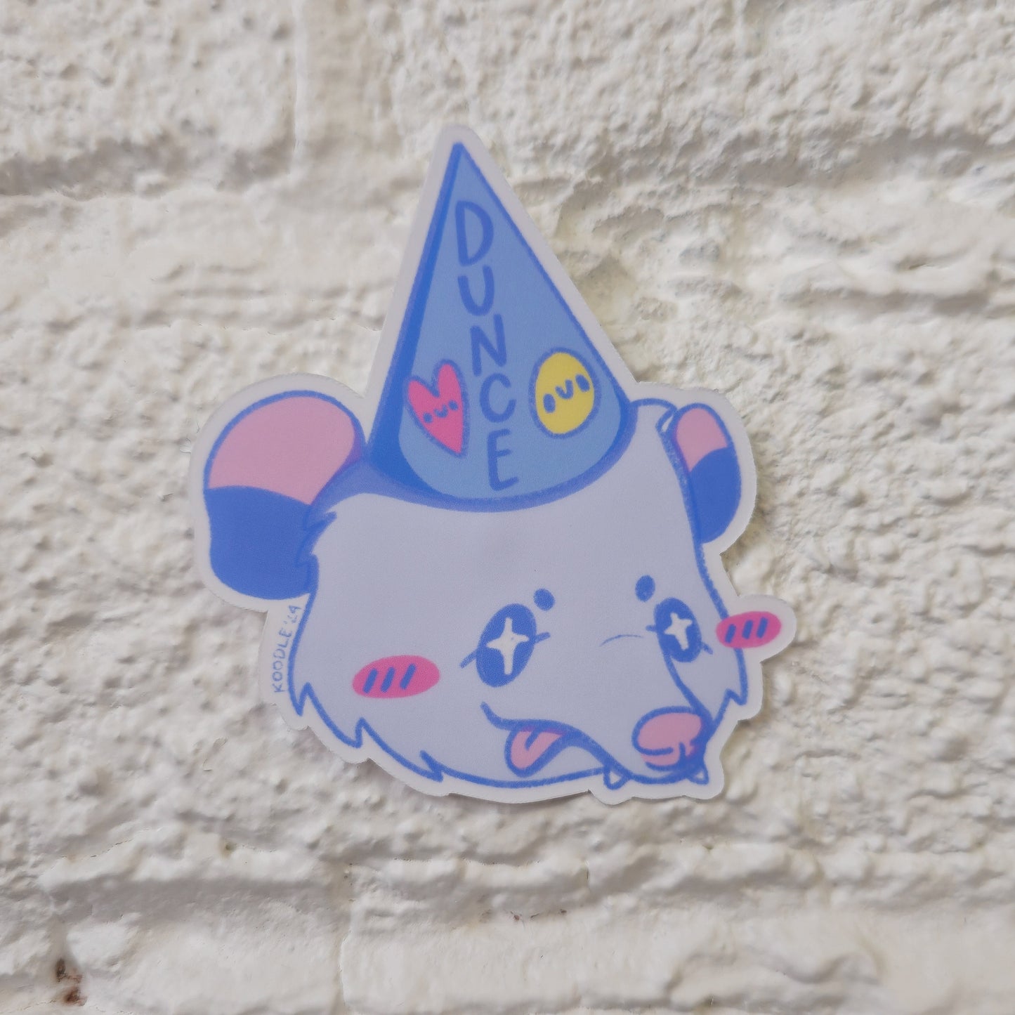 Silly Cute Opossum Wearing a Dunce Cap Matte Pastel Sticker - Koodle