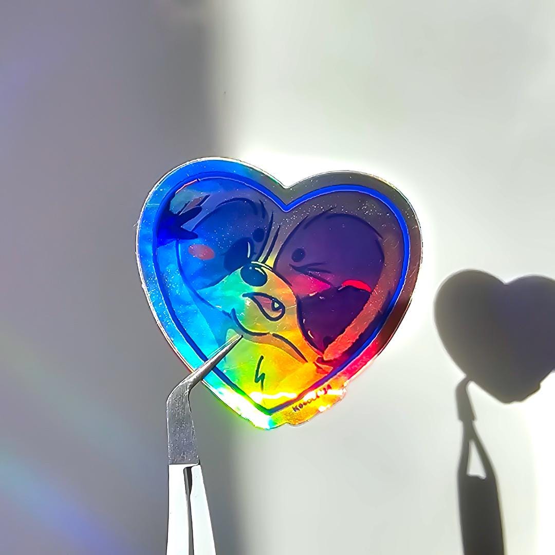 Cute Raccoon Squished Against Heart - Shaped Window Holographic Sticker - Koodle