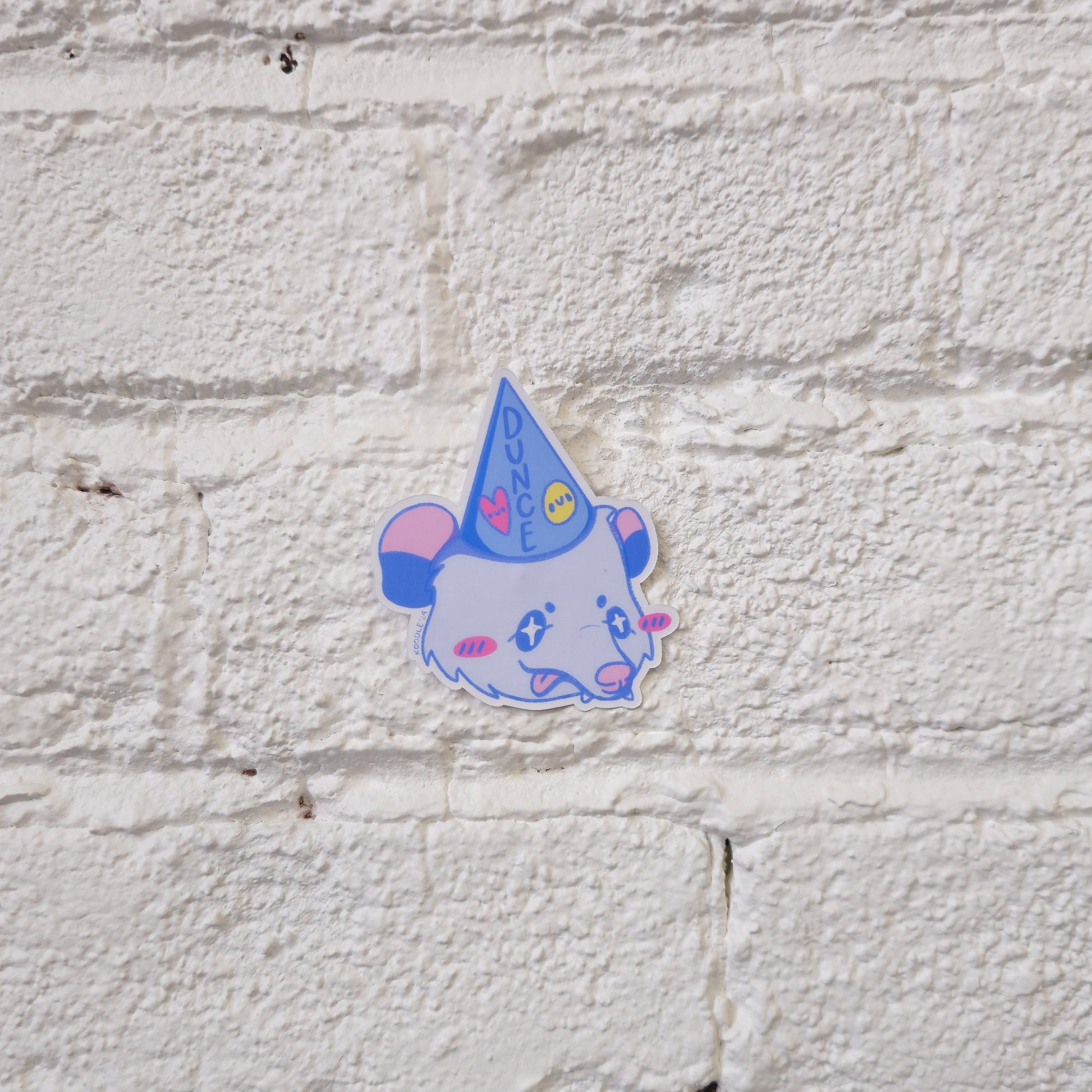 Silly Cute Opossum Wearing a Dunce Cap Matte Pastel Sticker - Koodle