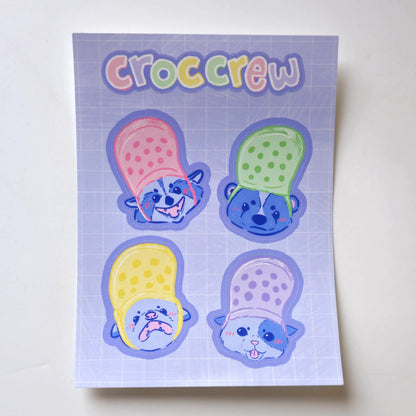 Croc Crew Sticker Sheet Featuring An Opossum, Skunk, Raccoon and Cat Wearing Crocs As Hats - Koodle